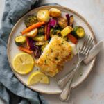 crispy air fried cod with lemon and vegetables