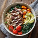 Beef protein bowl with steak, quinoa, and vegetables