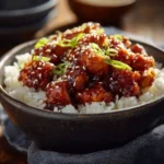 Honey BBQ Chicken Rice bowl with sesame seeds and green onions
