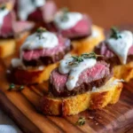 Beef Tenderloin Crostini with Parmesan Cream Sauce – Elegant, Warm & Effortless 3 Beef Tenderloin Crostini with Parmesan Cream Sauce – elegant appetizer with seared beef and creamy sauce