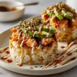 Crispy Salmon Rice Stack – golden rice topped with creamy salmon and avocado